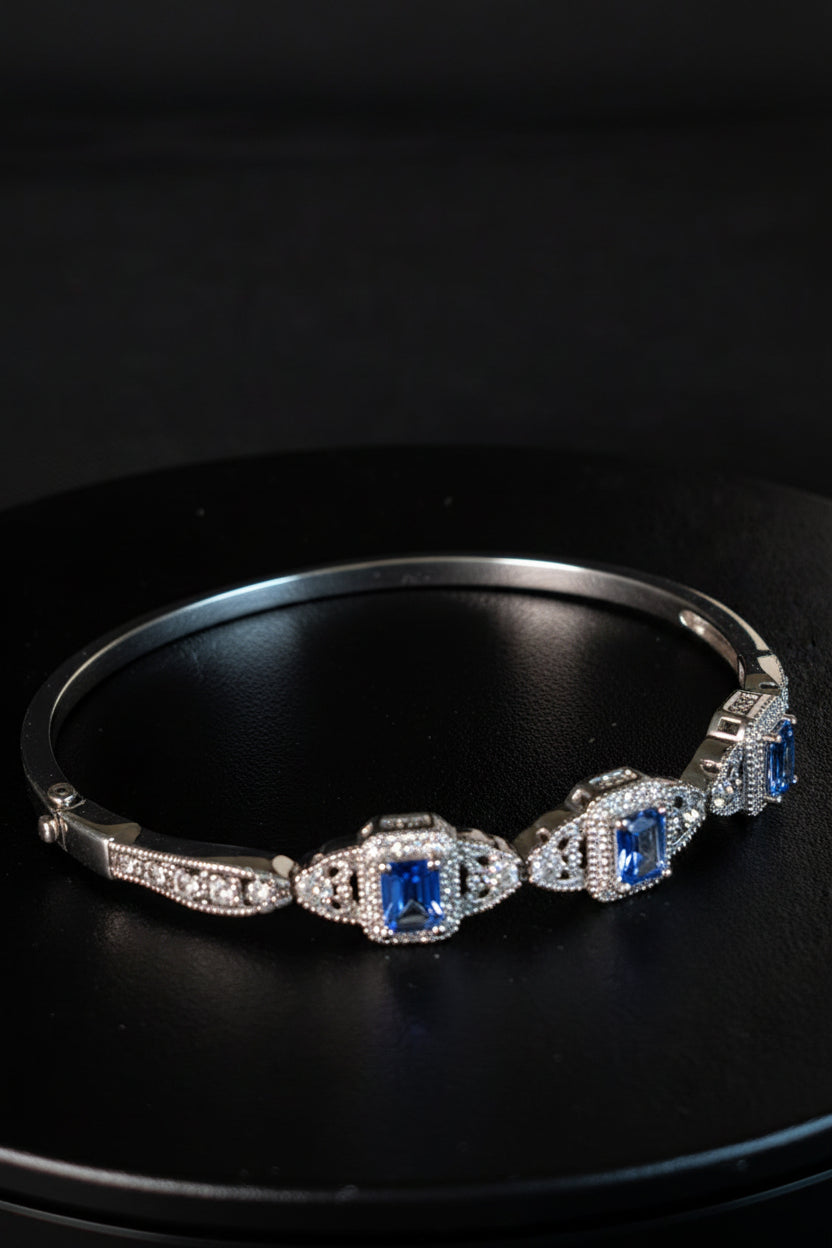 925 sterling silver Bangle hinged Bracelet with Ice blue Topaz like stones
