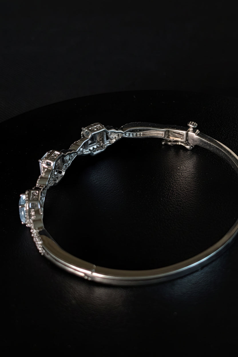 925 sterling silver Bangle hinged Bracelet with Ice blue Topaz like stones