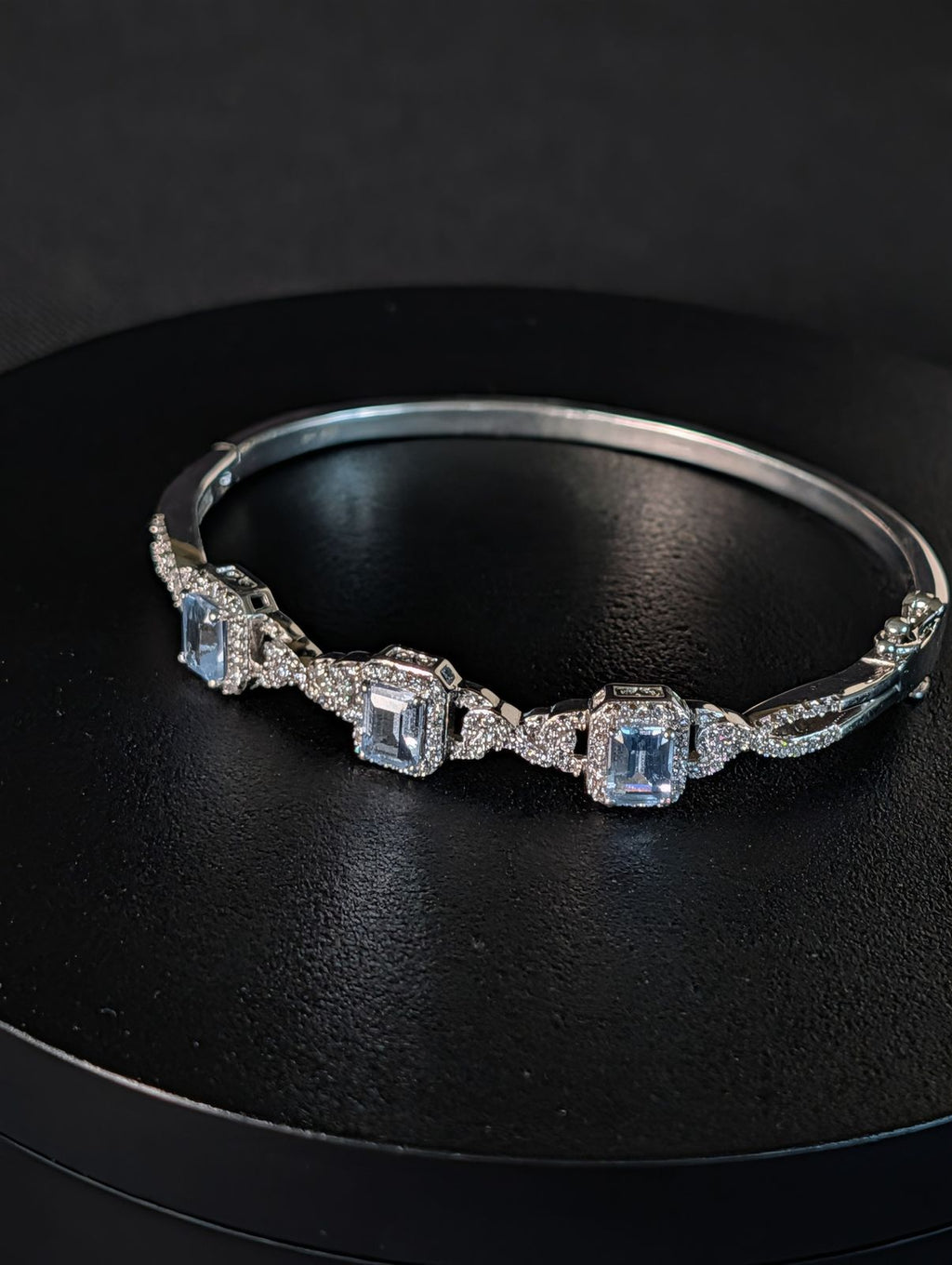 925 sterling silver Bangle hinged Bracelet with Ice blue Topaz like stones
